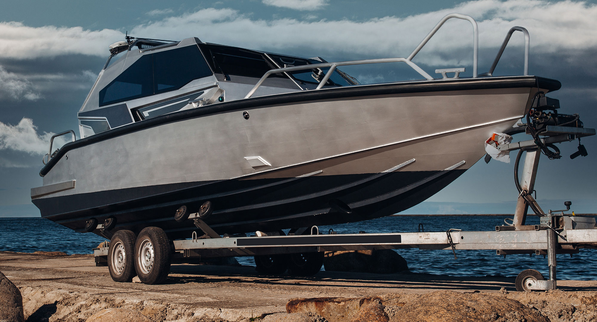Boat on a trailer with ocean in background
