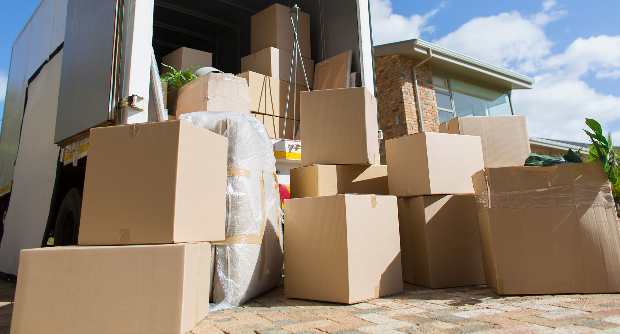 back of a truck with boxes prepared to be loaded.